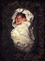 Infant sleeping in a manger